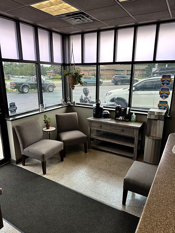 Customer waiting area at West Goshen Automotive & Fleet Services in West Chester, PA, with complimentary coffee and water